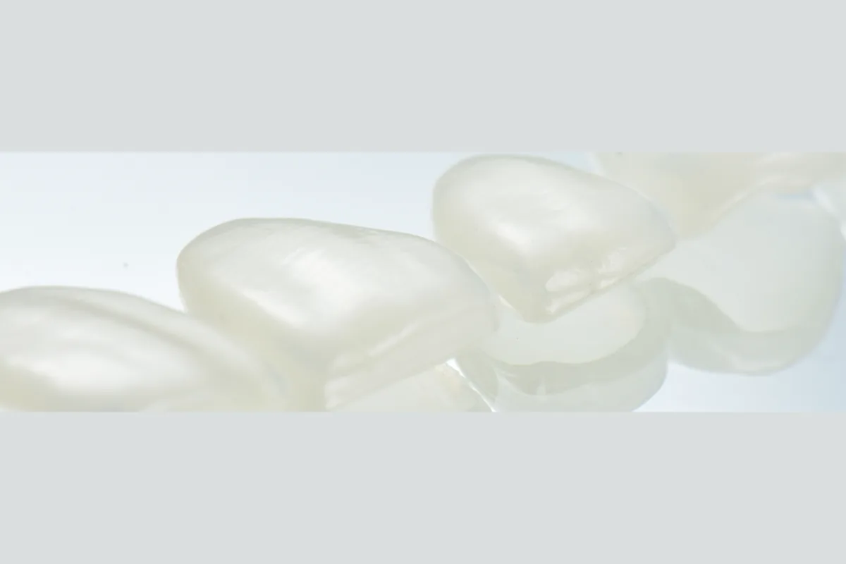 Ceramic veneer shells photographed against white, showing translucency